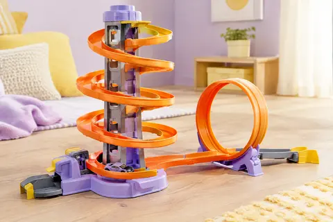 Circuit Hot Wheels avec tour motorisée, piste orange à looping et voiture miniature incluse